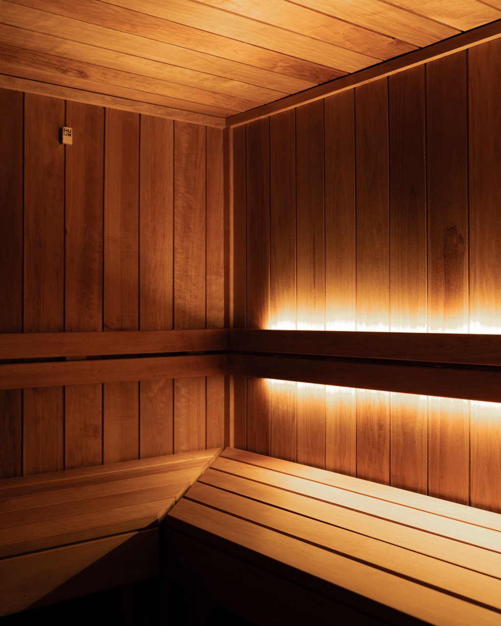 Container sauna interior, alternate angle, warm LED lighting